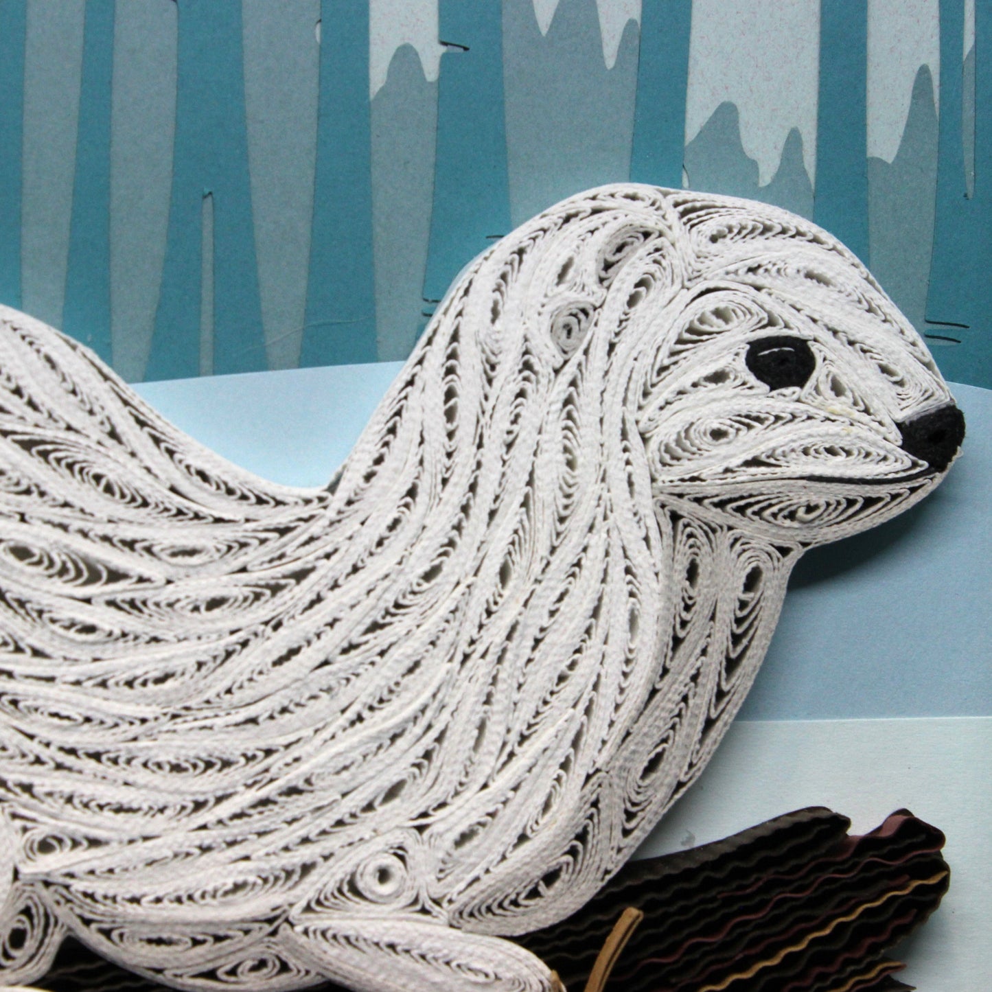 close up view of quilled white ermine face