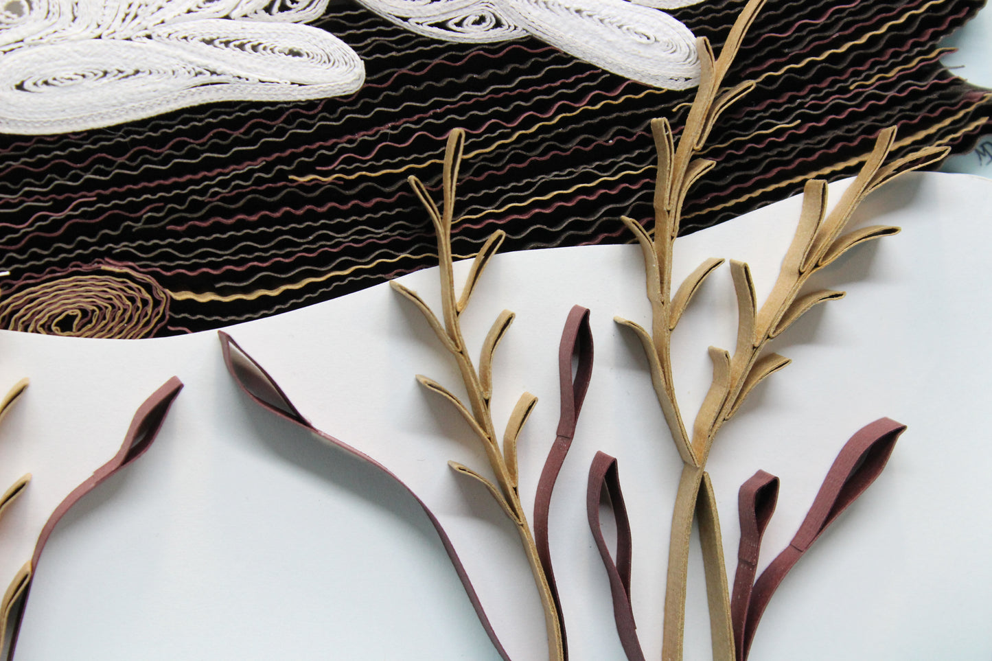 close up detail of quilled log and dry weeds