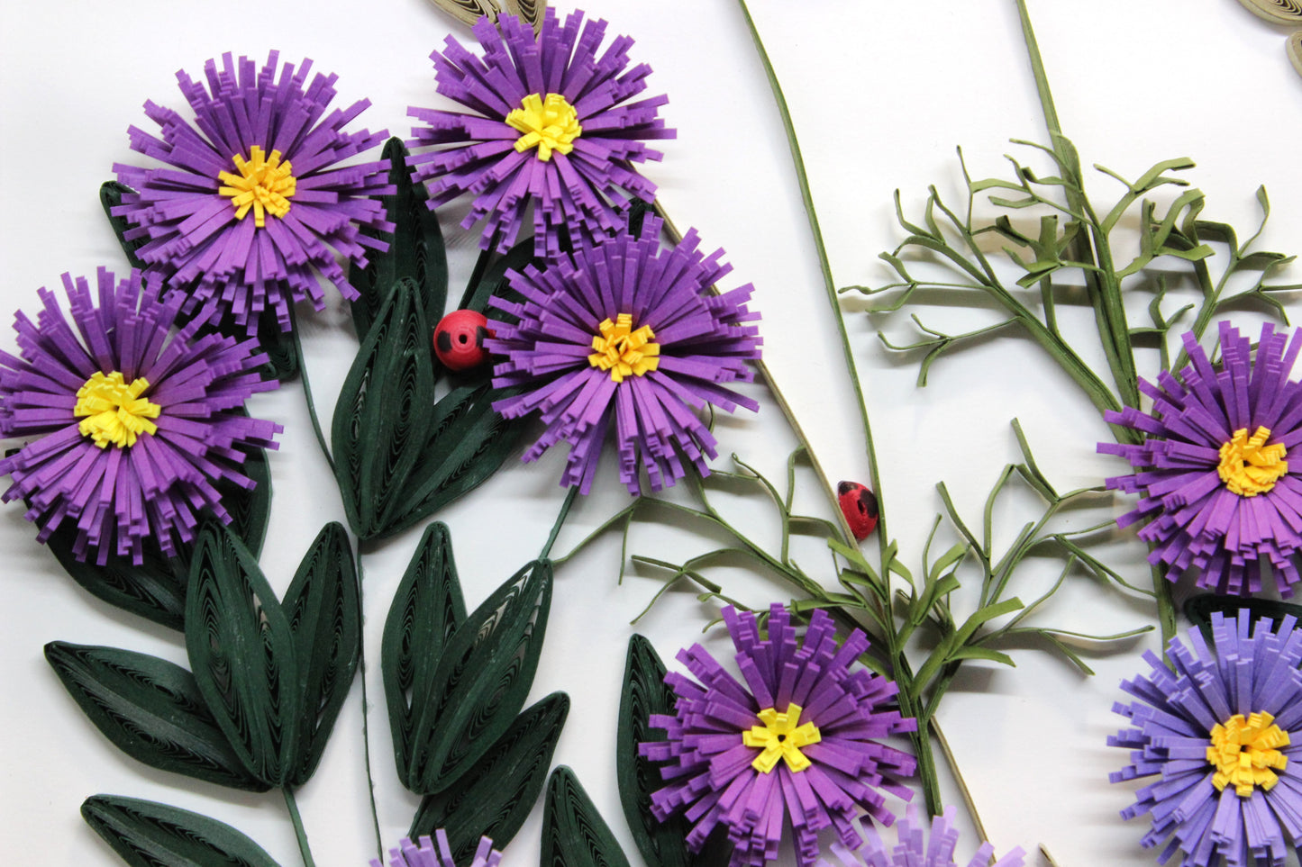 close up of purple wild asters, leaves, and ladybugs
