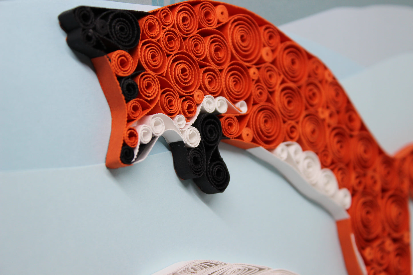 side angle close up view of quilled paper red fox