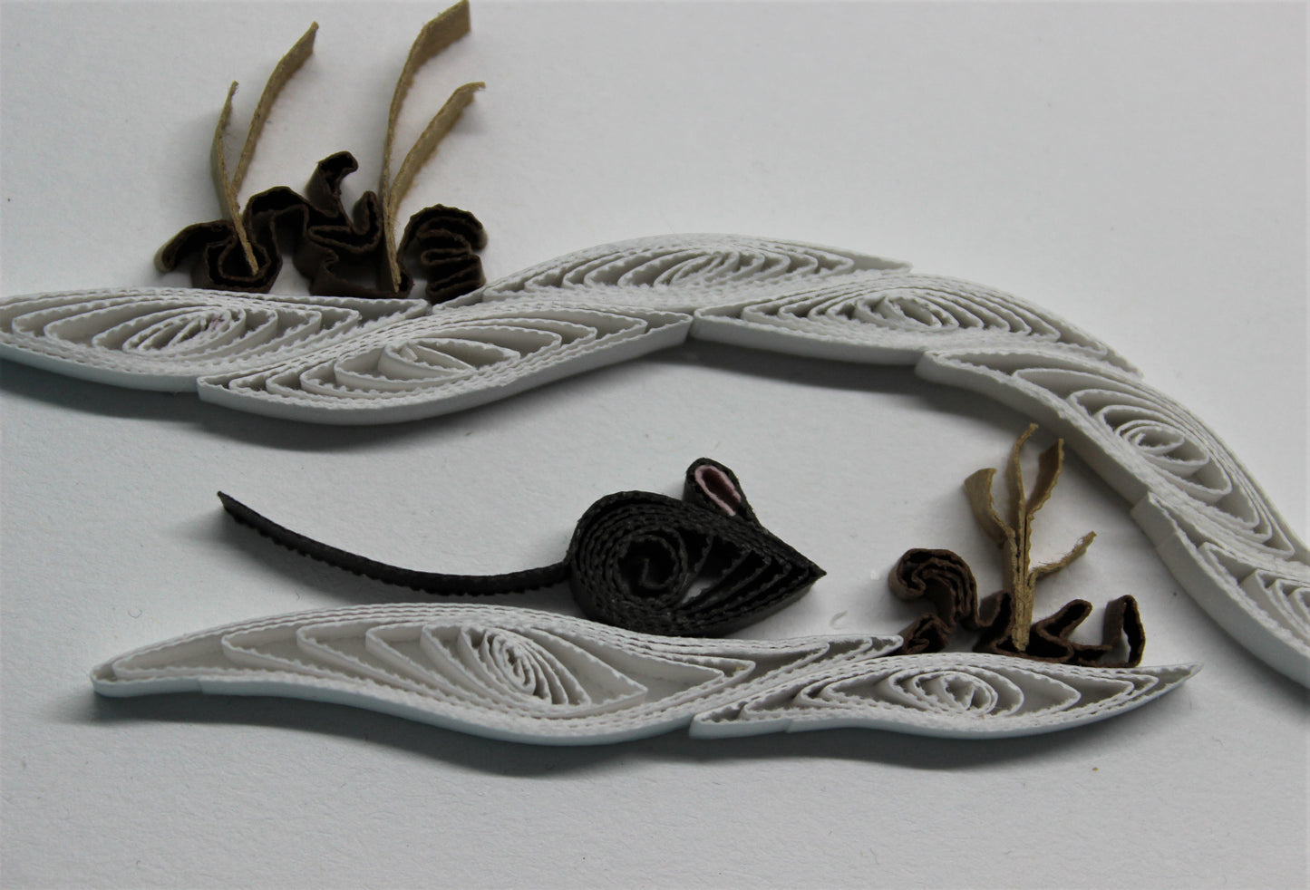 close up view of quilled mouse under snow